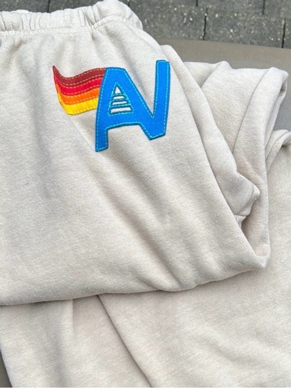 Aviator Nation Cream Sweatpants Unisex XL Raw Edge Bottoms Rainbow 'AN' Patch